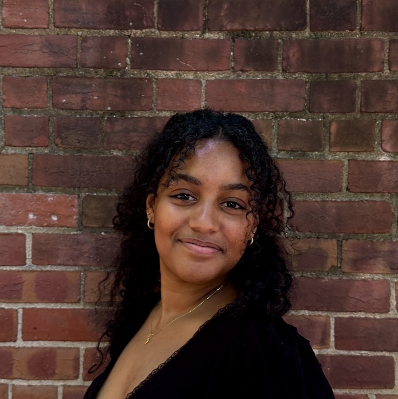 Headshot of Nia Ashenafi.