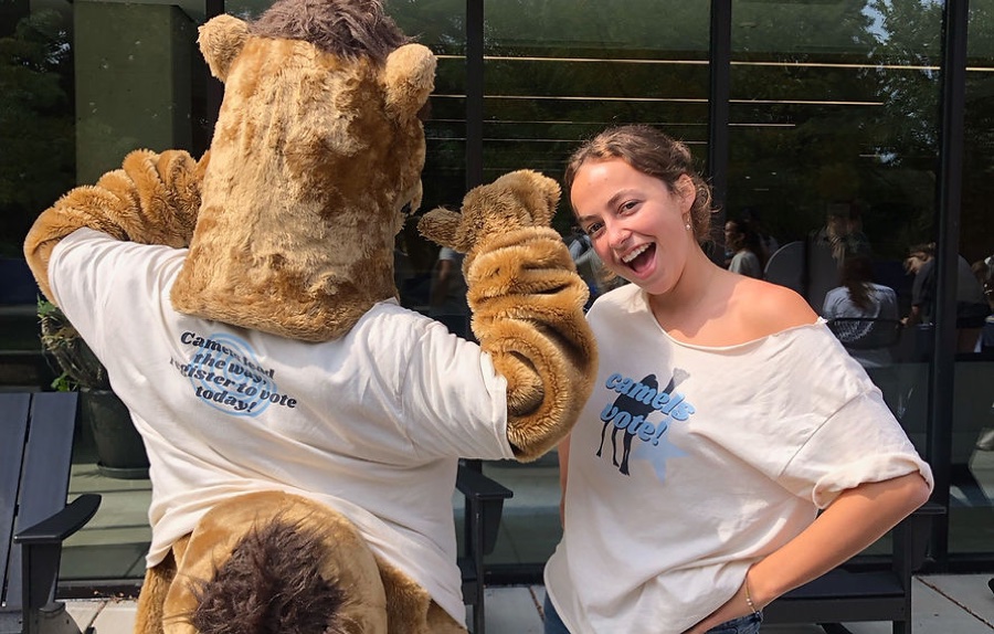 Camels Vote ambassadors helping students at the National Voter Registration Day drive.
